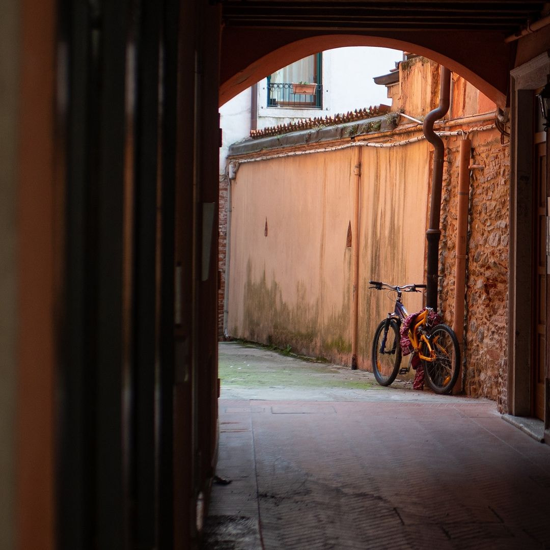 a bicycle parked in a doorway