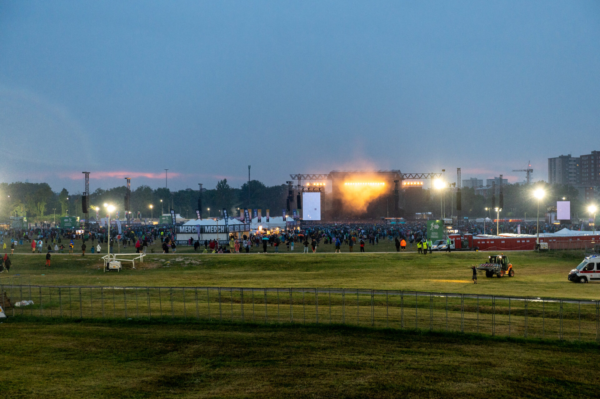 a large field with a crowd of people in it